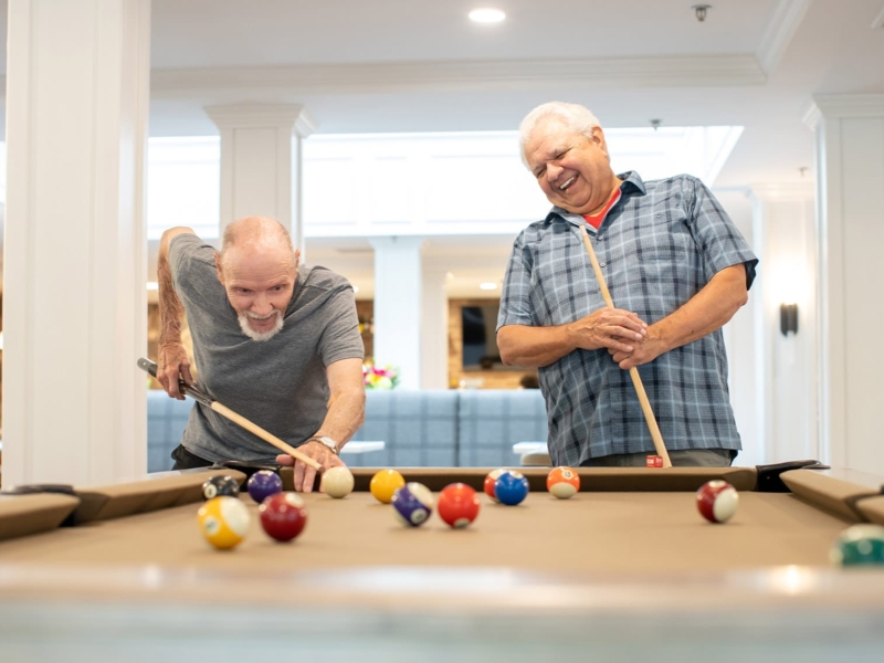 Two individuals playing pool at The Emerson at St. Peters.