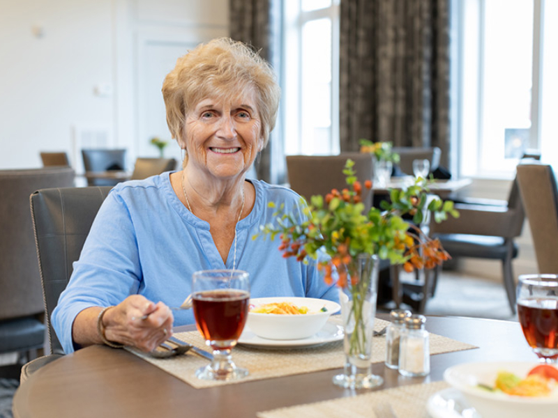 A resident enjoying a meet at The Emerson at St. Peters.