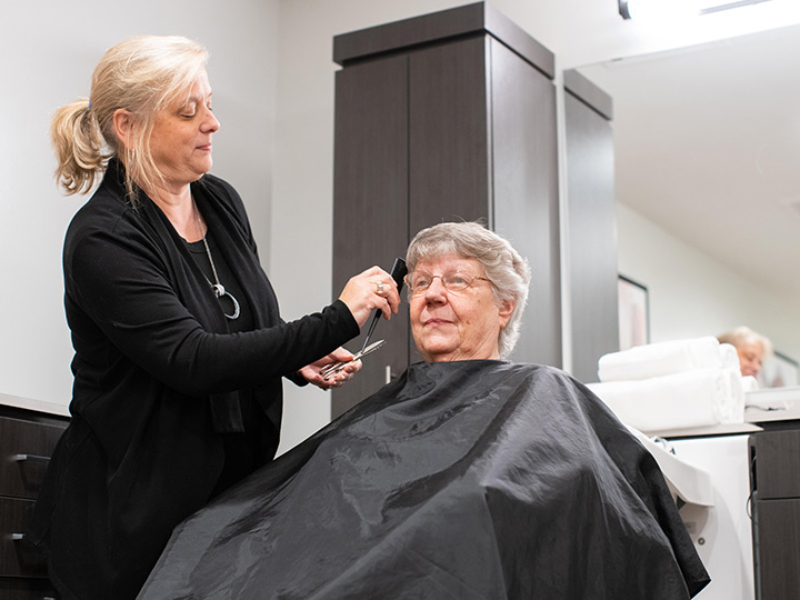 Receiving a haircut at The Emerson at St. Peters.