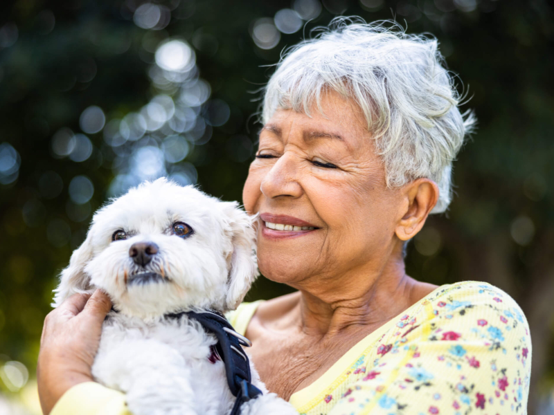 Senior woman holding her dog