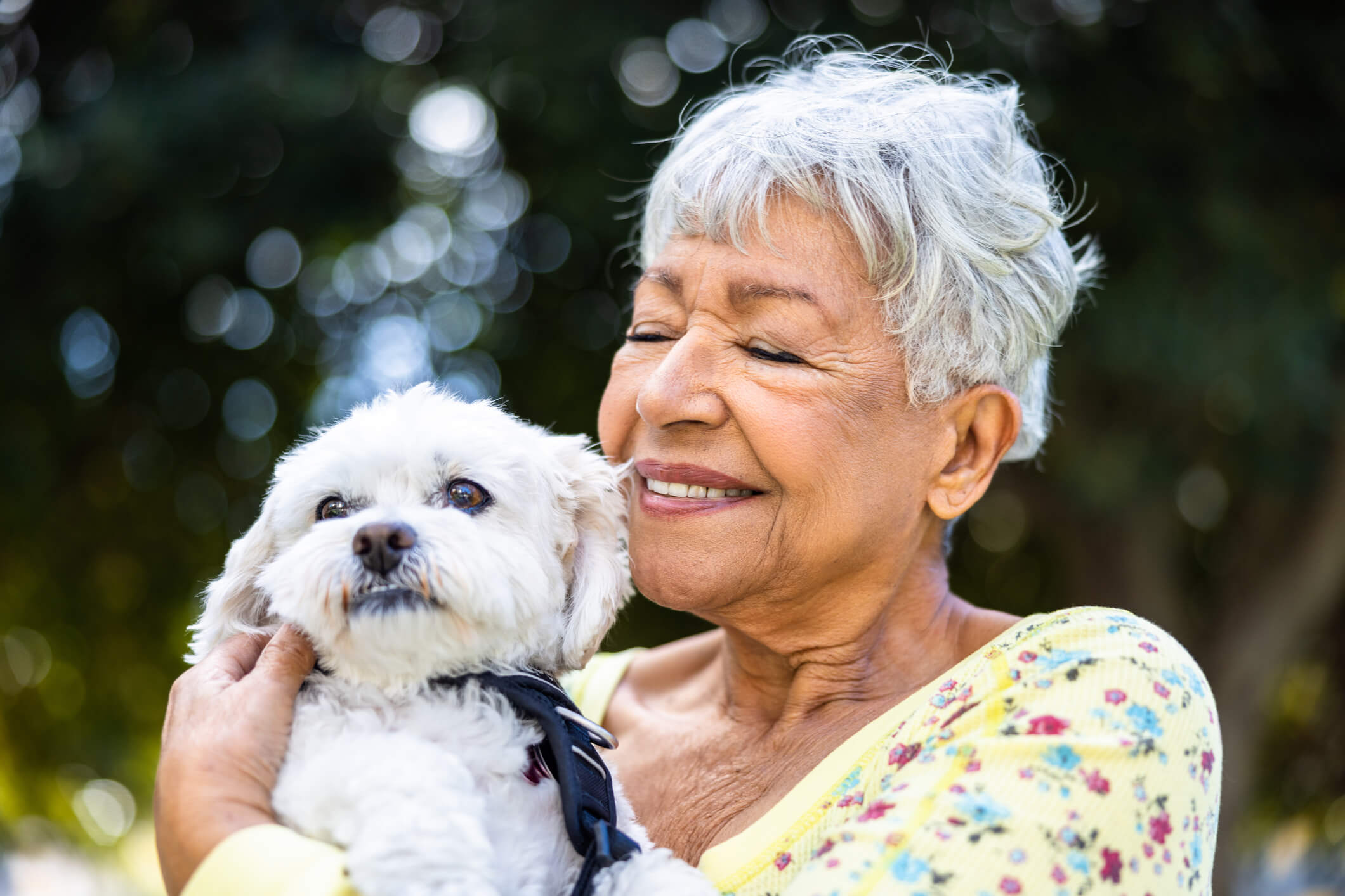 Senior woman holding her dog