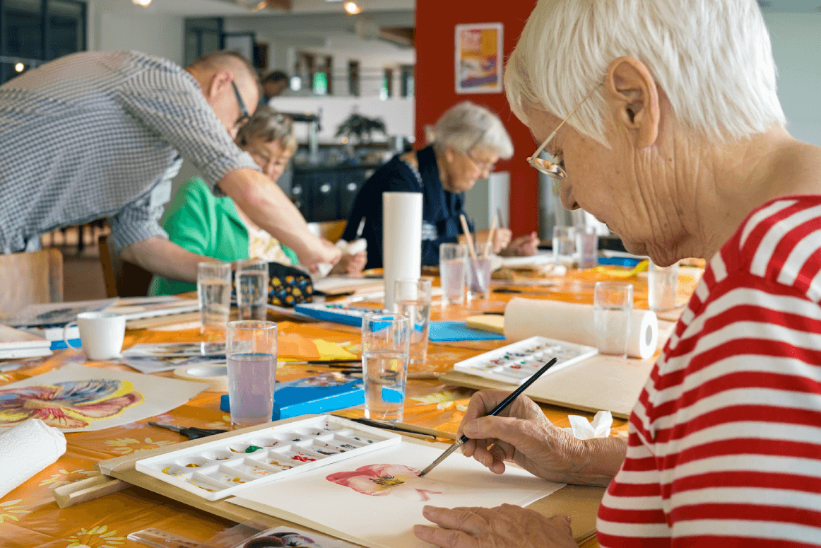 Senior woman painting