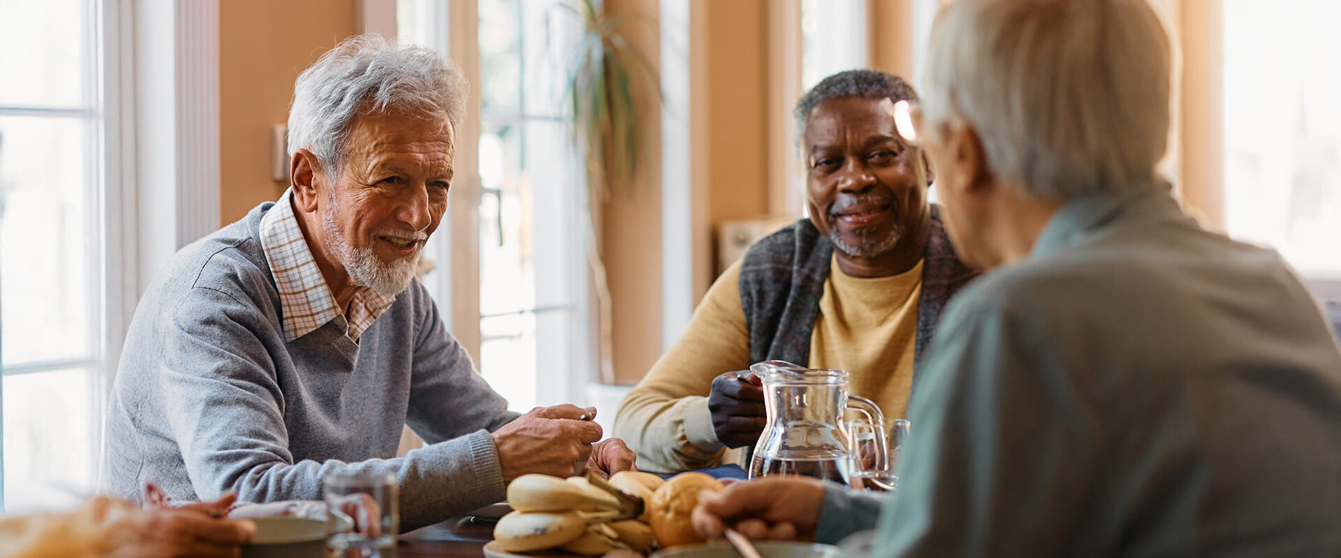 Men sitting around a table for breakfast